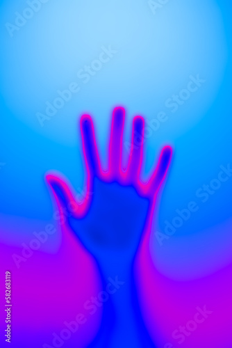 Silhouette of an open palm in neon light