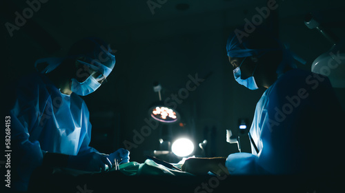 Doctors surgeons performing an operation on a patient in the operating room Generative AI
