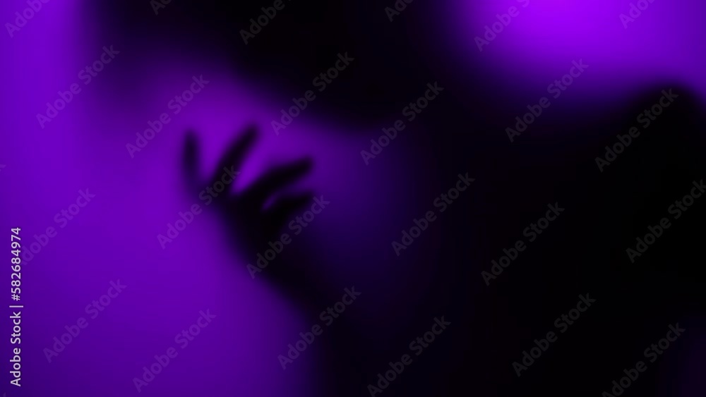 Silhouette of a woman dancing in a purple neon fog
Silhouette of a woman dancing in a purple neon fog