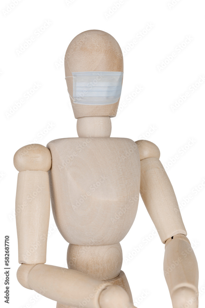 wooden mannequin doll in a medical mask isolated on white background wooden mannequin doll in a medical mask isolated on white background