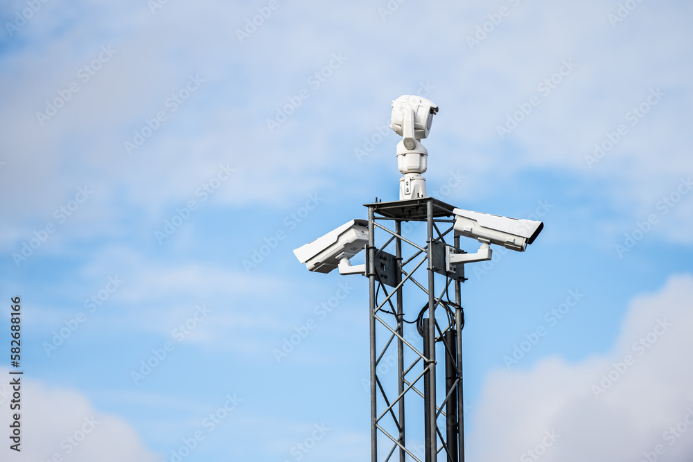 Traffic cameras on top of a pylon. Traffic cameras on top of a pylon.