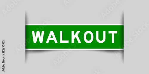 Inserted green color label sticker with word walkout on gray background