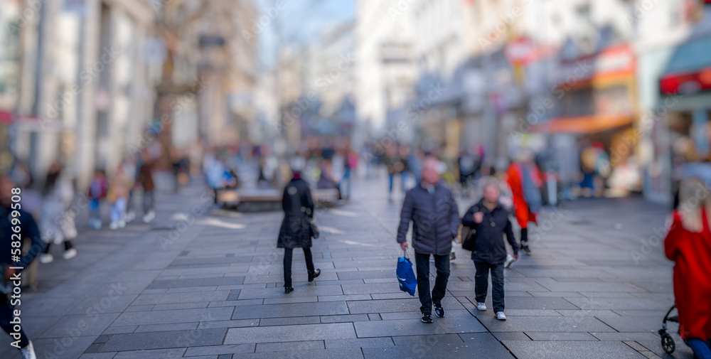 crowd of people walking on busy street 