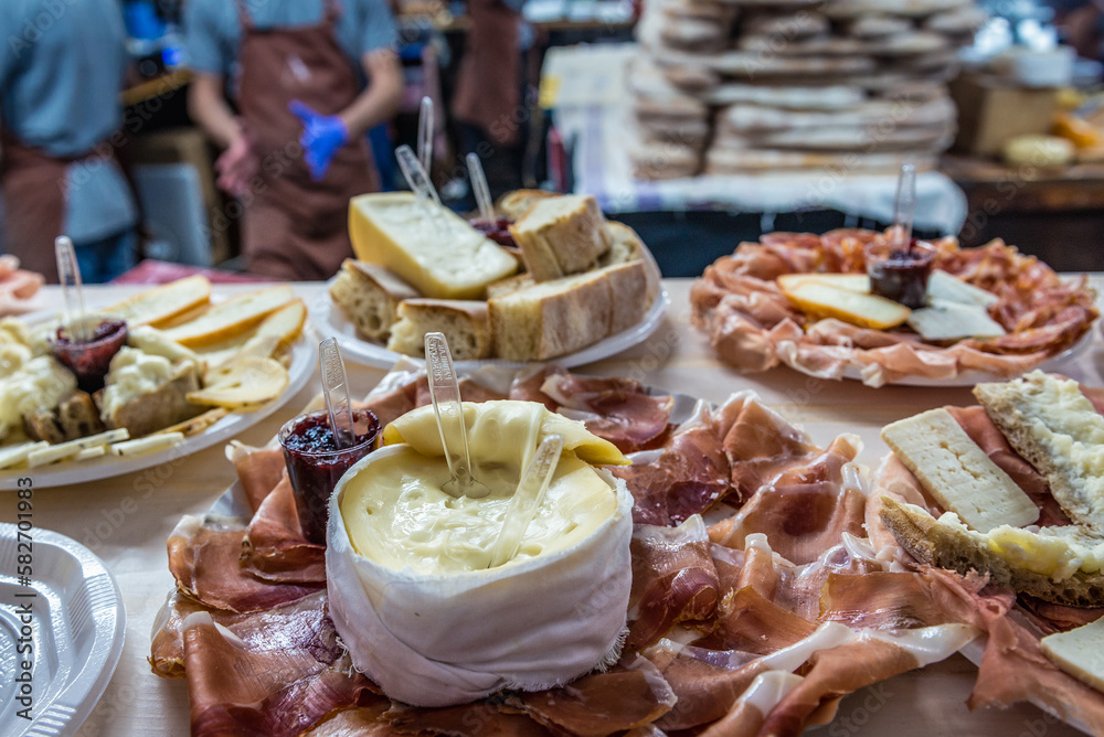 Cheese and ham on Mercado da Baixa market on a Fig Tree Square in Lisbon, Portugal