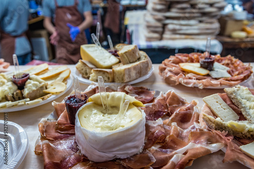 Cheese and ham on Mercado da Baixa market on a Fig Tree Square in Lisbon, Portugal