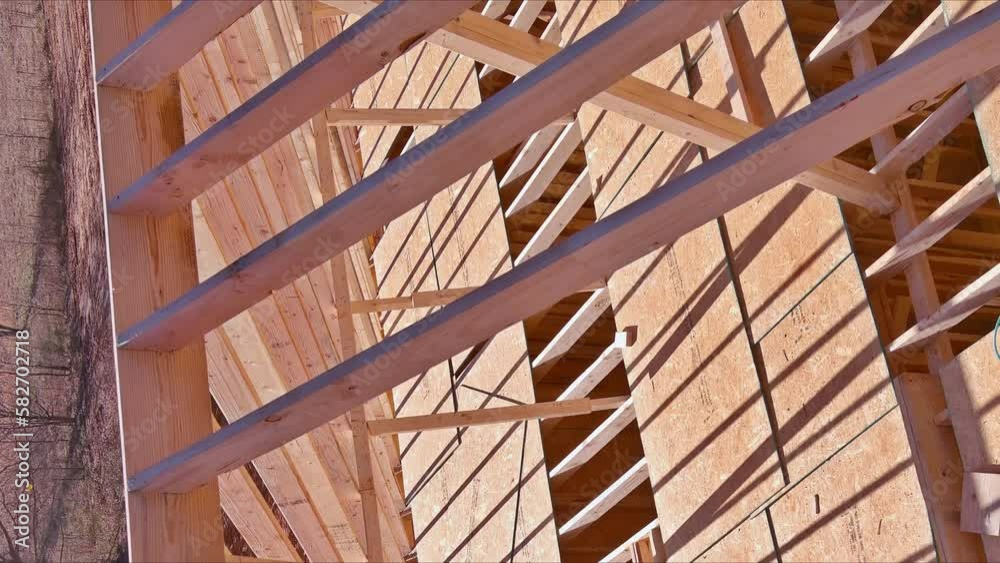 Wooden roofing framework consists of trusses beams were built while beam stick support roof to constructing new home. Wooden roofing framework consists of trusses beams were built while beam stick support roof to constructing new home.
