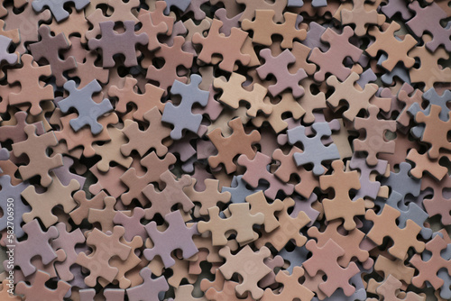 Close up piece of jigsaw puzzle as a concept of business success in challenge completion with teamwork. Selective focus of pieces jigsaw puzzle background