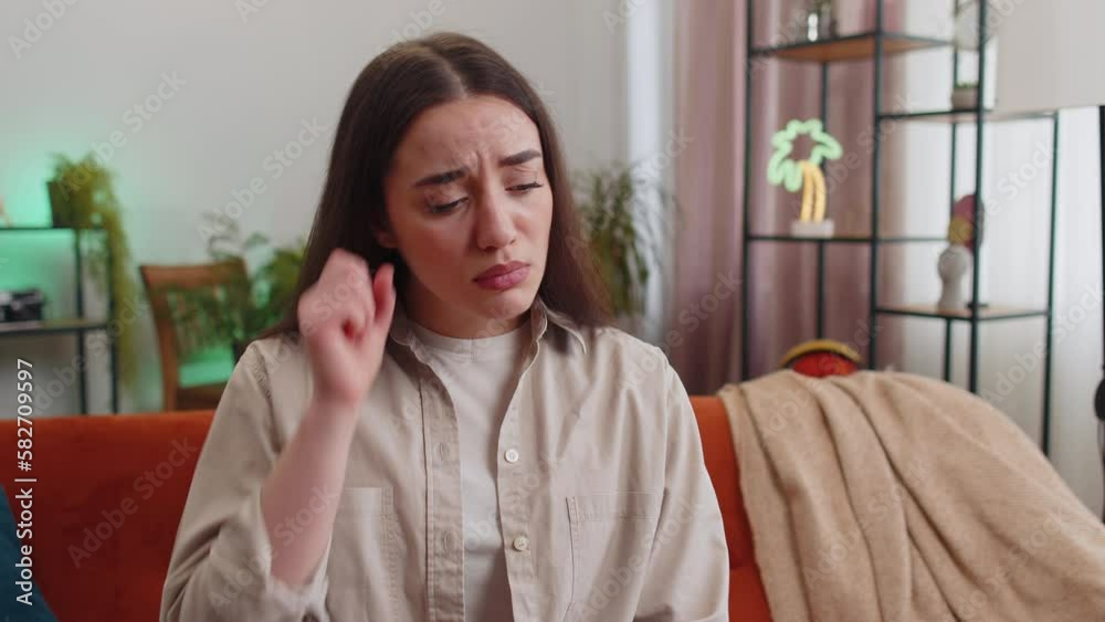 Upset disappointed young woman wipes tears and cries from despair, being sad because of unfair situation, unrequited love. Problem, break up, depressed feeling bad annoyed, burnout. Girl at home room