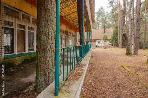 Dilapidated and abandoned building, roofing and terrace on an autumn day. Urbex, photo