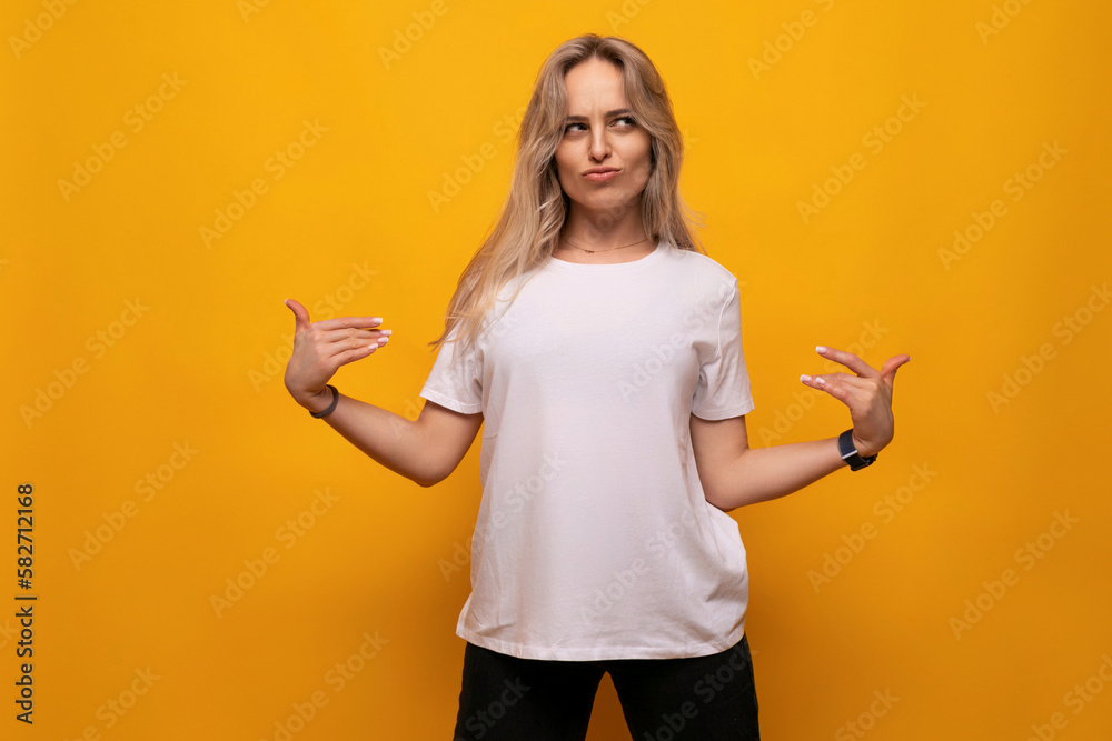 young lady in a white t-shirt mocap on a yellow background young lady in a white t-shirt mocap on a yellow background