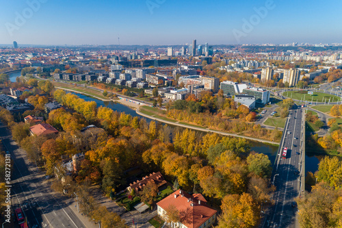 Vilnius Cityscape with Autumn Trees and Traffic. Lithuania