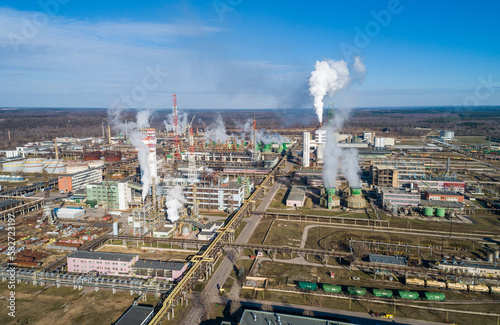 Chemistry Factory in Lithuania, Achema in Jonava City. Clear Blue Sky and Smoke in background. Drone © Mindaugas Dulinskas
