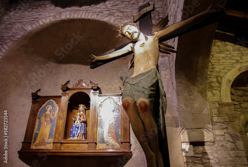 Sanctuary of Santa Maria di Canneto - Roccavivara - Molise - In the foreground the wooden Crucifix and in the background  Madonna di Canneto. Called the Virgin of the smile