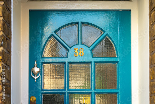 House number 38 in blue photo