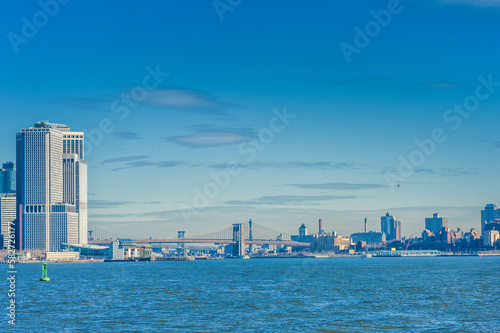 Hudson River and Manhattan Skyline. Brooklyn Bridge in Background. NYC, USA photo