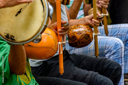 Afro Brazilian percussion musical instruments during a capoeira performance in the streets of Brazil