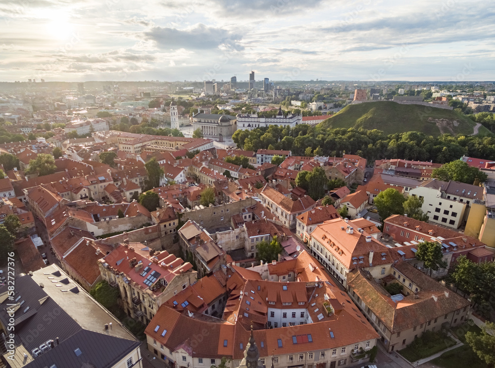 Vilnius Old Town with Many Old Streets and Cathedral Square and Bell Tower in Background. Lithuania. Sunset Time