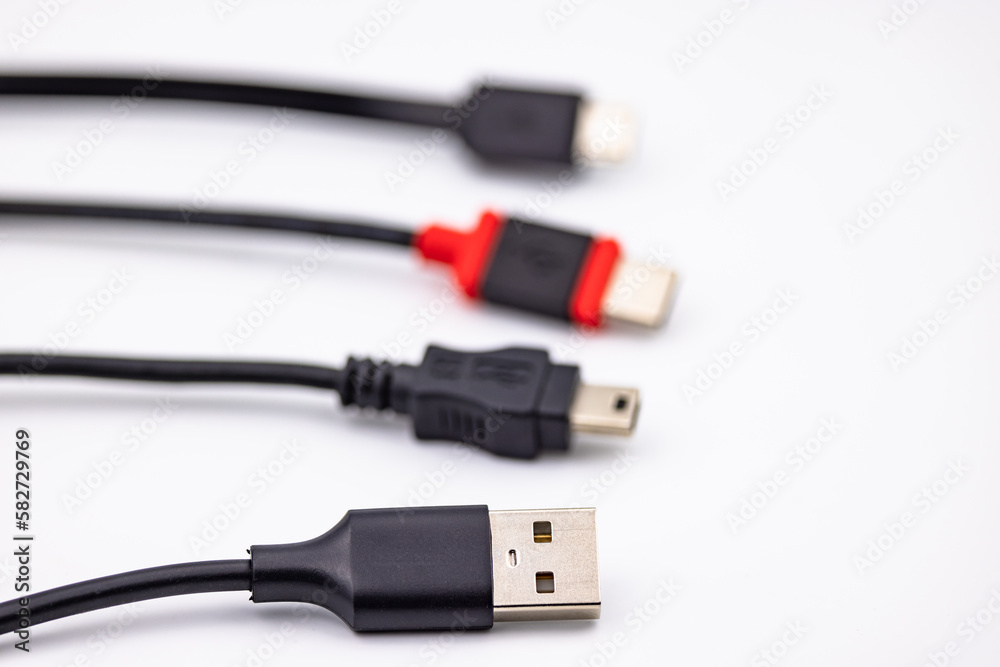 USB mini connector selectively released next to other USB cables USB mini connector selectively released next to other USB cables