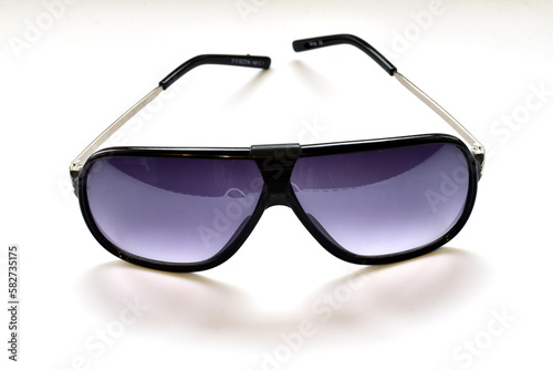 The picture shows modern fashionable glasses with dark, round, sun glasses.