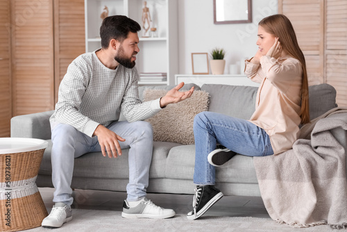 Young man quarreling with h...