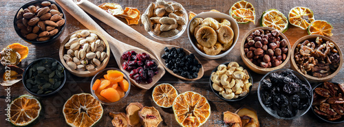 Fototapeta Naklejka Na Ścianę i Meble -  Composition with a variety of dried fruits and assorted nuts.
