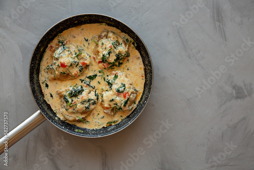 Homemade Creamy Tuscan Chicken with Spinach, top view. From above, overhead, flat lay. Copy space.