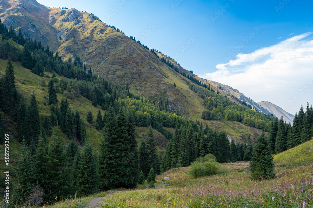 A mystical landscape in the mountains not far from Almaty. The intersection of light and shadows in the mountains.