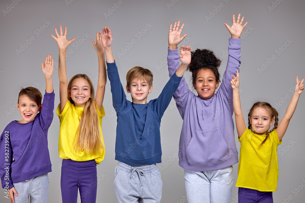 group of cheerful children pulled his hands up isolated grey background togetherness friendship peace group of cheerful children pulled his hands up isolated grey background togetherness friendship peace