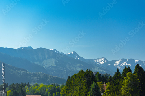 Pine forests and snow mountains in Haut-Intyamon, Gruyere, Fribourg, Switzerland