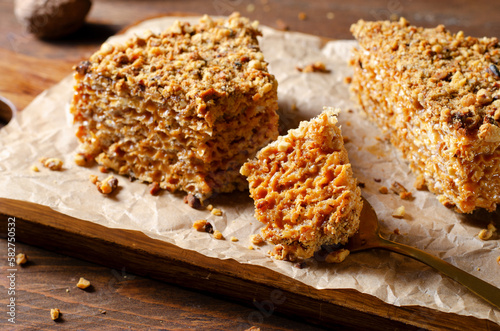 Wafer Cake with Condensed Milk and Nuts, Layered Cake on Wooden Background