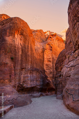 Colorful Siq canyon in Petra, Jordan. Stone walls natural formation. 