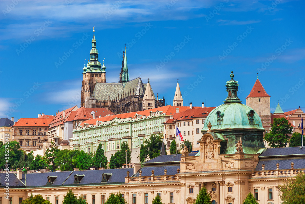 View of Prague old historical center with gothic St. Vitus Cathedral and Straka Academy baroque dome