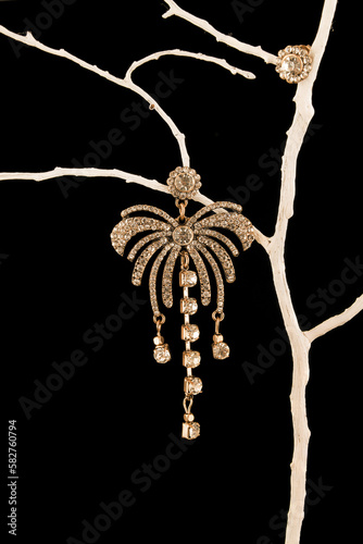 earrings with diamonds isolated on black background. © Golden Shark