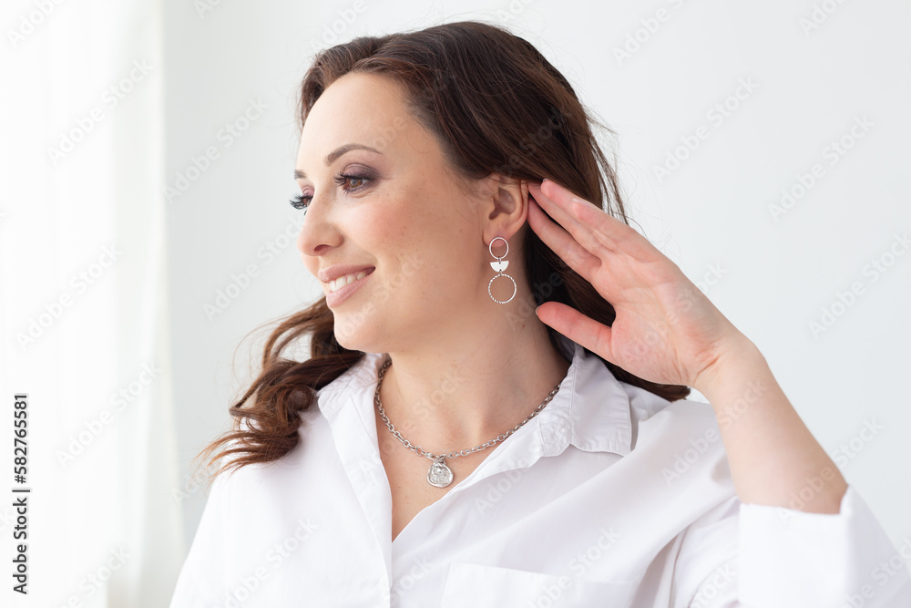 Fashionable and stylish woman in trendy jewelry big earrings . Fashion look beauty and style. Natural makeup and easy styling Fashionable and stylish woman in trendy jewelry big earrings . Fashion look beauty and style. Natural makeup and easy styling