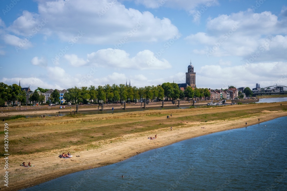 Beautiful view of a beach and city in the background in Deventer, Netherlands