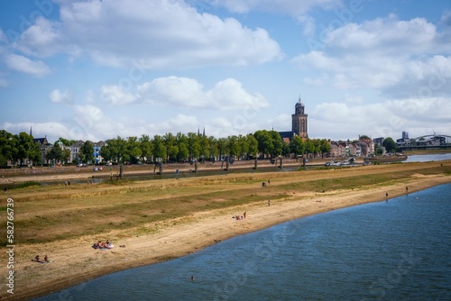 Beautiful view of a beach and city in the background in Deventer, Netherlands
