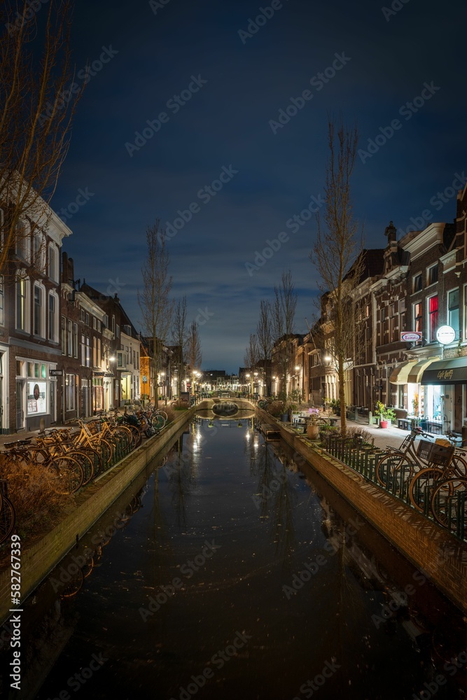 Evening view of an empty street  and calm river in a town