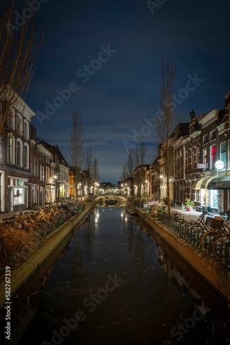 Evening view of an empty street and calm river in a town