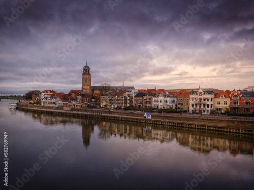Cityscape of the river city Deventer, Netherlands with a view of St Lebuinus church on a cloudy day