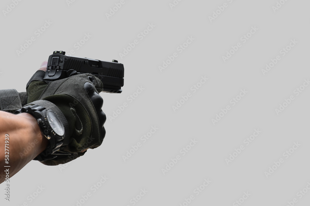 Isolated automatic 9mm pistol gun  holding in hand of shooter with clipping paths.
