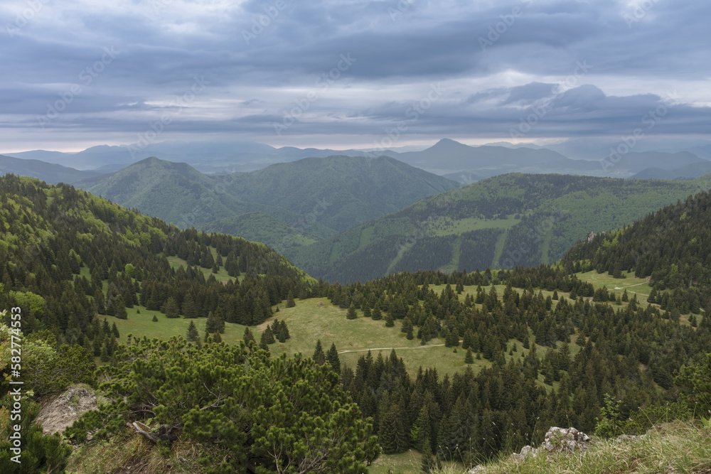 View from Maly Rozsutec to mountain pass Medzirozsutce , Mala Fatra, Slovakia in spring cloudy morning
