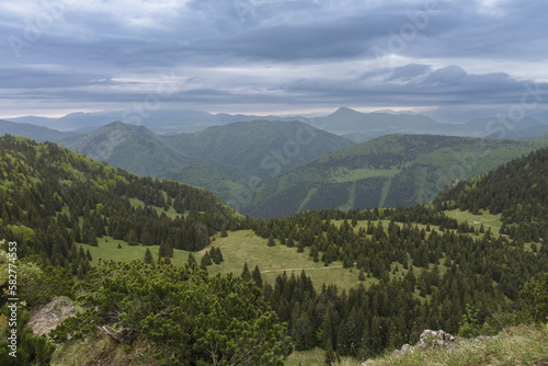 View from Maly Rozsutec to mountain pass Medzirozsutce , Mala Fatra, Slovakia in spring cloudy morning photo