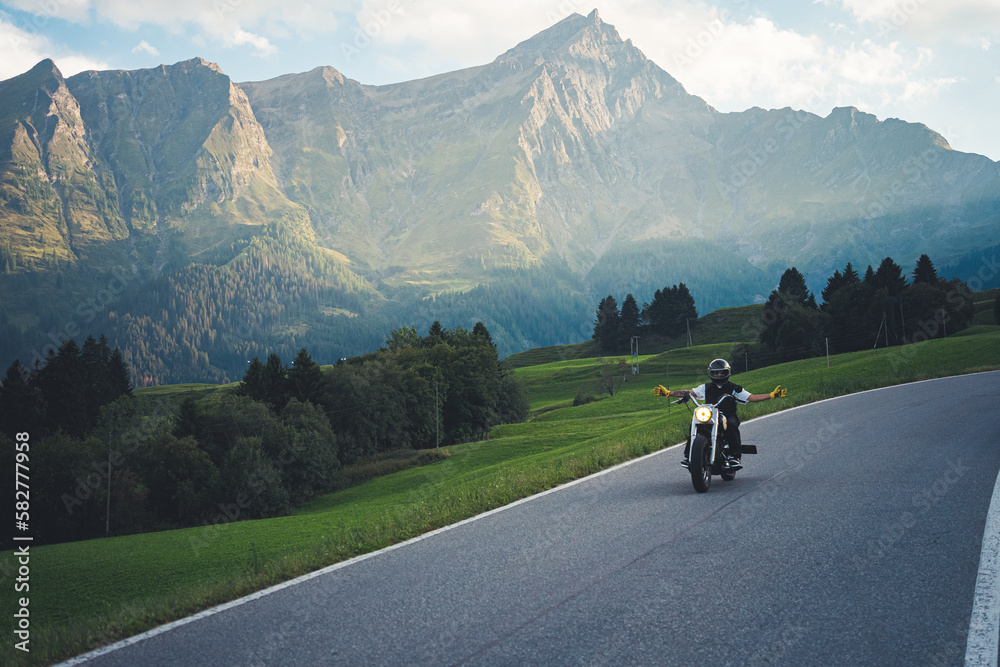 Riding a classic motorbike in the swiss alps Riding a classic motorbike in the swiss alps