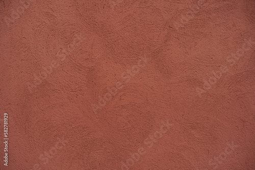 High resolution clay colored wall texture background, pattern, collage, wrapping paper, wallpaper... Image of textured stucco in matte terracotta color.