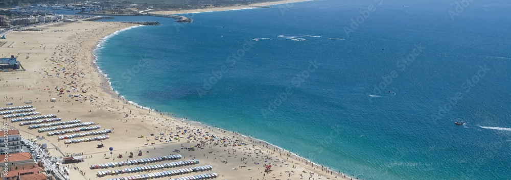 Nazare, beach resort in Portugal, during summer, aerial view of the bay

