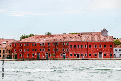 Beautiful shot of the historic Residenza Grandi Vedute building across the water in Venice, italy photo