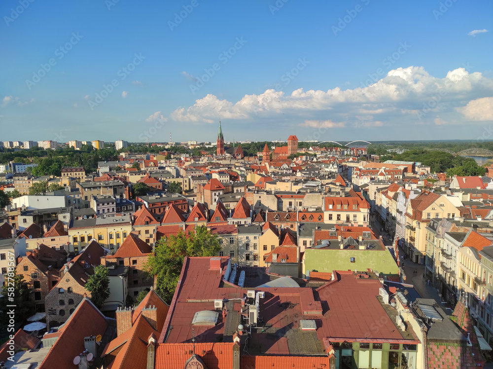 View from tower on church of St. Catherine, St. James and other historical buildings in center of old city. Torun, Poland