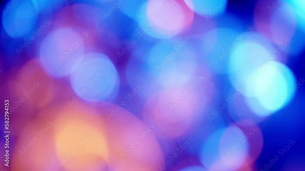Red, Yellow, and Blue Bokeh Glow on a Dark Background Red, Yellow, and Blue Bokeh Glow on a Dark Background