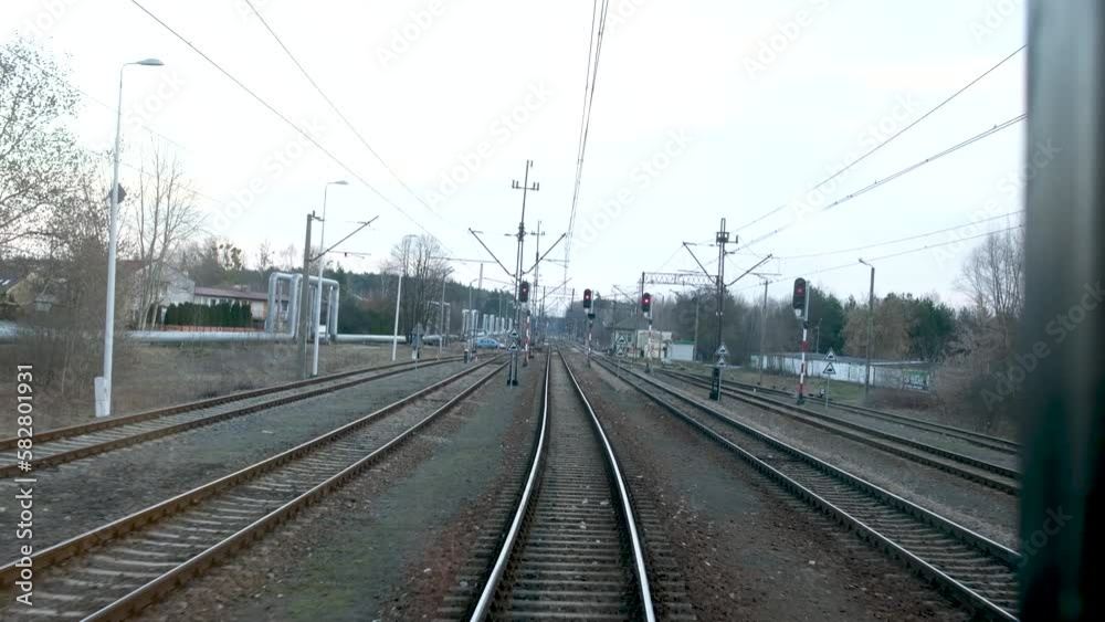 train leaves from Przemysl to Warsaw passes various villages in spring or winter without snow train leaves from Przemysl to Warsaw passes various villages in spring or winter without snow