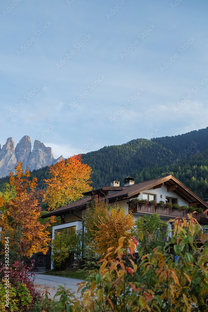 Wooden House at the Famous Santa Maddalena Village, Val di Funes valley, Trentino Alto Adige region, Italy; Beautiful View of the Dolomites Mountains in the Background